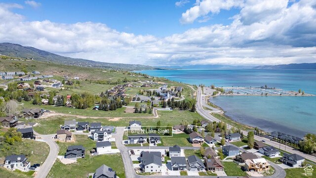 670 N Lake Sight Dr, Garden City, UT 84028 - aerial view of property and surrounding area with a water and mountain view and nearby suburban area