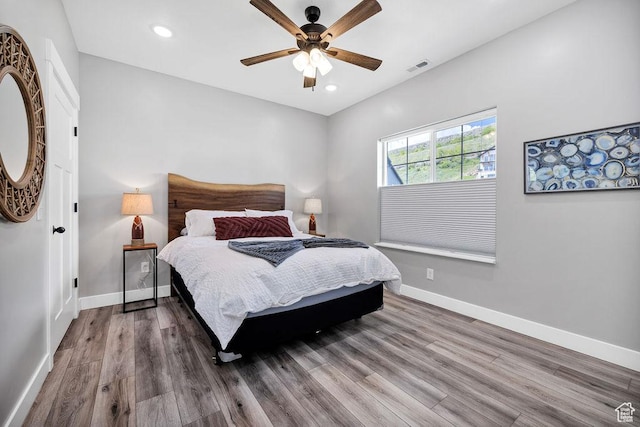 670 N Lake Sight Dr, Garden City, UT 84028 - bedroom featuring wood finished floors, baseboards, recessed lighting, and a ceiling fan