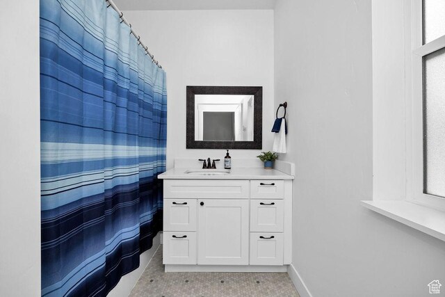 670 N Lake Sight Dr, Garden City, UT 84028 - full bathroom featuring vanity, baseboards, and a shower with shower curtain