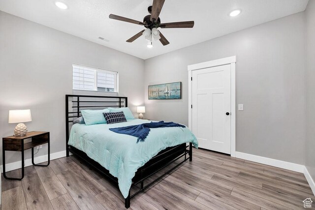 670 N Lake Sight Dr, Garden City, UT 84028 - bedroom featuring light wood finished floors, baseboards, recessed lighting, and a ceiling fan