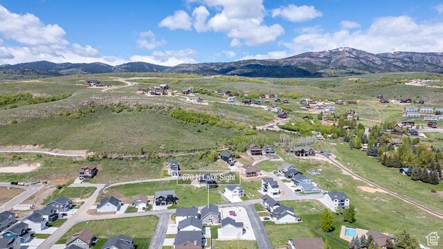 670 N Lake Sight Dr, Garden City, UT 84028 - aerial overview of property's location featuring mountains and nearby suburban area