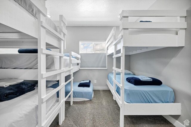 670 N Lake Sight Dr, Garden City, UT 84028 - bedroom with baseboards, carpet floors, and a textured ceiling