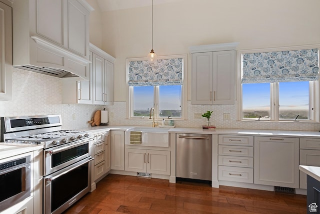 281 N Almond St W, Salt Lake City, UT 84103 - kitchen with stainless steel appliances, a sink, light countertops, and tasteful backsplash