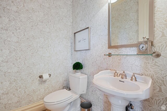 281 N Almond St W, Salt Lake City, UT 84103 - bathroom featuring toilet, wallpapered walls, and a sink
