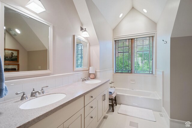 281 N Almond St W, Salt Lake City, UT 84103 - bathroom with lofted ceiling, a garden tub, double vanity, recessed lighting, and tile patterned floors