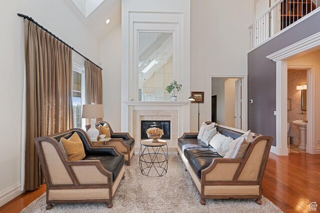 281 N Almond St W, Salt Lake City, UT 84103 - living room featuring high vaulted ceiling, wood finished floors, a tile fireplace, and baseboards