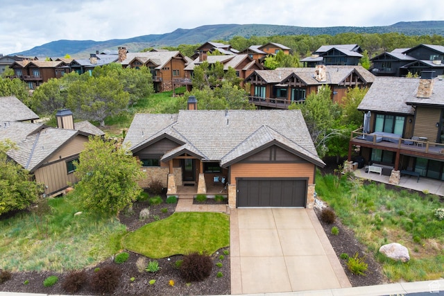 1765 E Kings Peak Cir Unit Cp-21, Heber City, UT 84032 - view of front of property featuring a residential view, a garage, driveway, and a mountain view