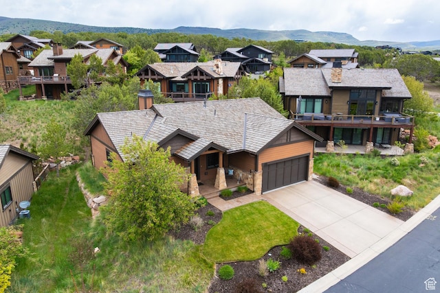 1765 E Kings Peak Cir Unit Cp-21, Heber City, UT 84032 - view of front of home with covered porch, driveway, an attached garage, and a residential view