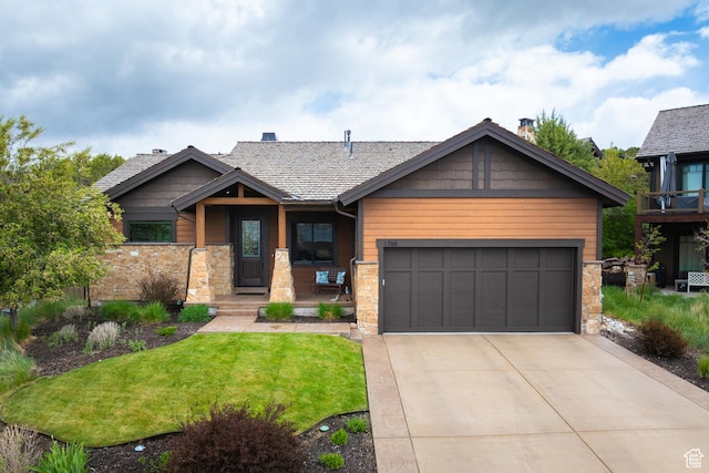 1765 E Kings Peak Cir Unit Cp-21, Heber City, UT 84032 - view of front of house with stone siding, a front lawn, an attached garage, driveway, and a porch