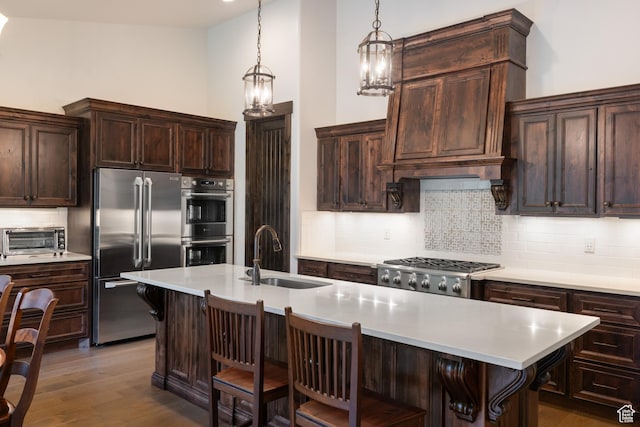 1765 E Kings Peak Cir Unit Cp-21, Heber City, UT 84032 - kitchen with appliances with stainless steel finishes, a sink, light countertops, and tasteful backsplash