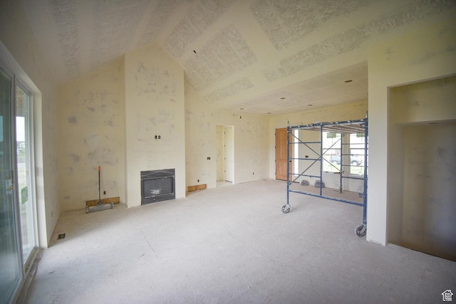 76 W 200 S, Hyde Park, UT 84318 - unfurnished living room with a large fireplace and high vaulted ceiling