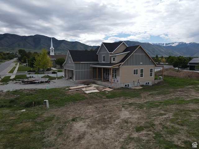 76 W 200 S, Hyde Park, UT 84318 - rear view of house featuring board and batten siding, a mountain view, and a porch