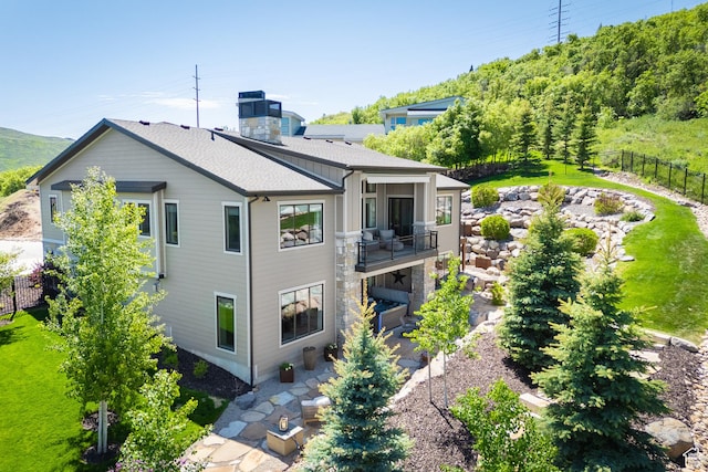 13200 N Alexis Dr, Heber City, UT 84032 - back of property featuring a balcony and a patio