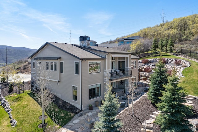 13200 N Alexis Dr, Heber City, UT 84032 - view of home's exterior featuring a balcony, a mountain view, and a patio area