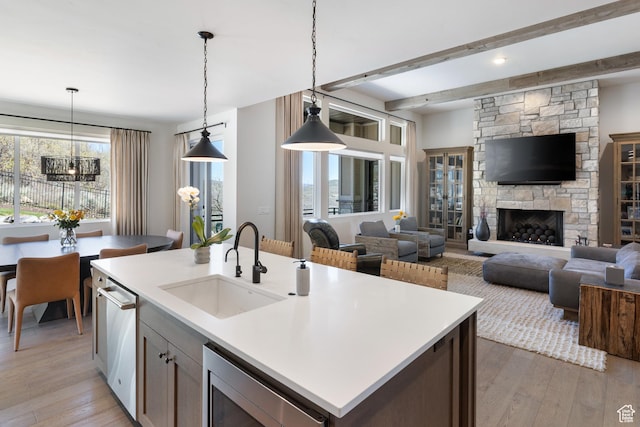 13200 N Alexis Dr, Heber City, UT 84032 - kitchen with a sink, light wood-type flooring, pendant lighting, and beamed ceiling