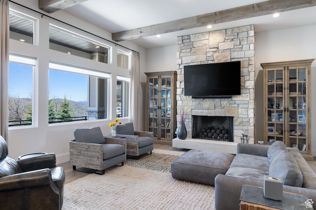 13200 N Alexis Dr, Heber City, UT 84032 - living room with beam ceiling, wood finished floors, healthy amount of natural light, a stone fireplace, and recessed lighting
