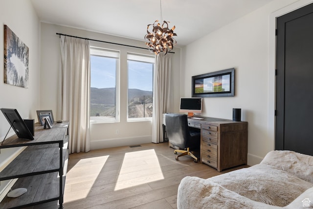 13200 N Alexis Dr, Heber City, UT 84032 - bedroom with a chandelier, baseboards, light wood-style floors, and a desk