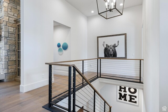 13200 N Alexis Dr, Heber City, UT 84032 - staircase featuring wood finished floors, a chandelier, baseboards, and recessed lighting