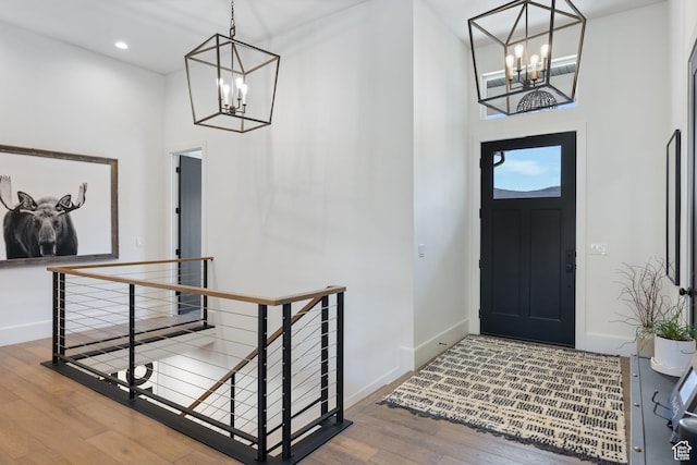 13200 N Alexis Dr, Heber City, UT 84032 - foyer entrance with a chandelier, a high ceiling, wood-type flooring, baseboards, and recessed lighting