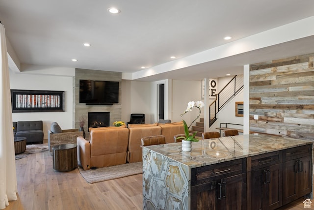 13200 N Alexis Dr, Heber City, UT 84032 - living room featuring a fireplace, light wood finished floors, recessed lighting, and stairs