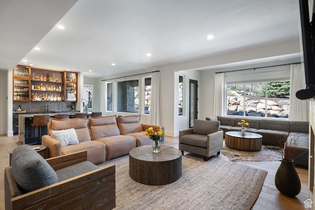 13200 N Alexis Dr, Heber City, UT 84032 - living area featuring bar with sink, recessed lighting, and wood finished floors