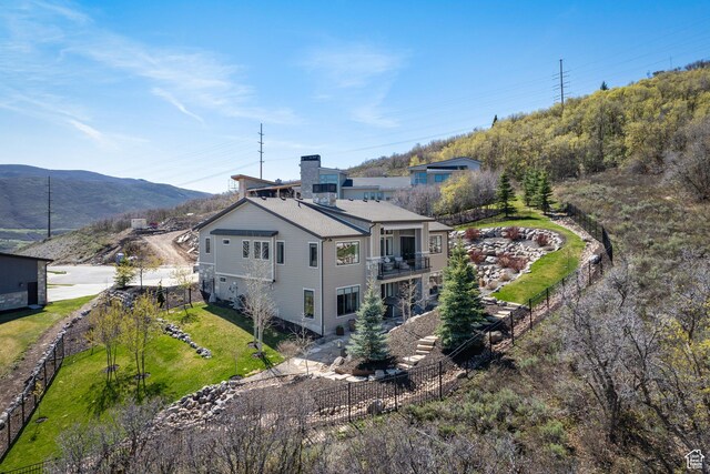 13200 N Alexis Dr, Heber City, UT 84032 - rear view of house with stairway, a balcony, a mountain view, and a chimney