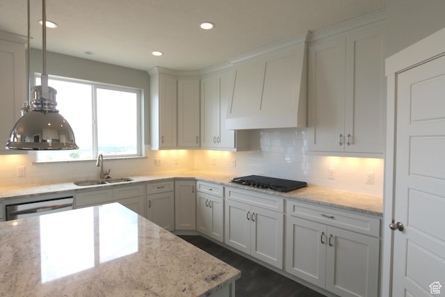 324 S 2800 E Unit 204, Spanish Fork, UT 84660 - kitchen with a sink, black cooktop, premium range hood, tasteful backsplash, and stainless steel dishwasher