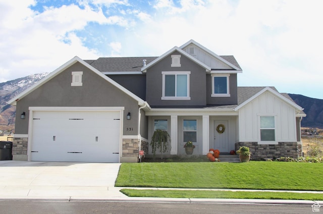 324 S 2800 E Unit 204, Spanish Fork, UT 84660 - craftsman house with board and batten siding, stone siding, driveway, roof with shingles, and a front yard