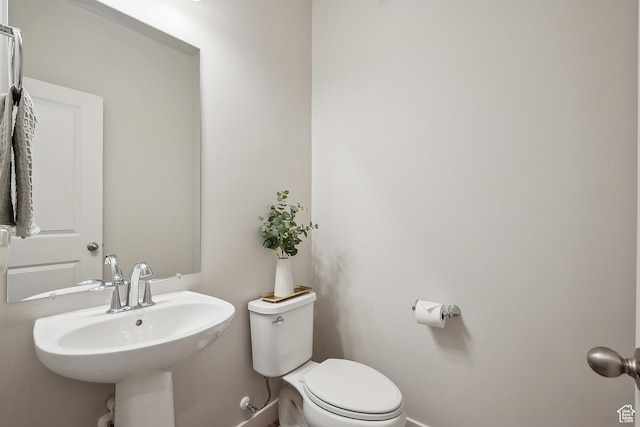 5991 Westridge Rd, Heber City, UT 84032 - half bath featuring baseboards, toilet, and a sink