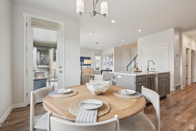 5991 Westridge Rd, Heber City, UT 84032 - dining space with wood finished floors, a chandelier, baseboards, and recessed lighting