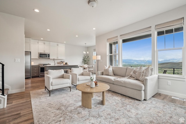 5991 Westridge Rd, Heber City, UT 84032 - living area with baseboards, wood finished floors, recessed lighting, and a mountain view
