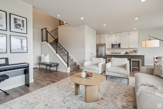 5991 Westridge Rd, Heber City, UT 84032 - living area featuring wood finished floors, stairway, recessed lighting, and baseboards