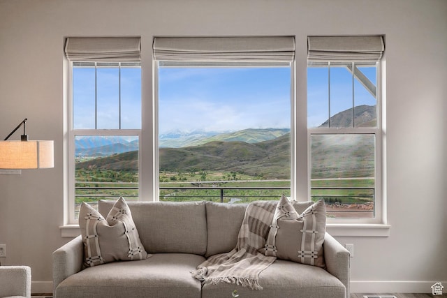 5991 Westridge Rd, Heber City, UT 84032 - living area with a mountain view, baseboards, and healthy amount of natural light