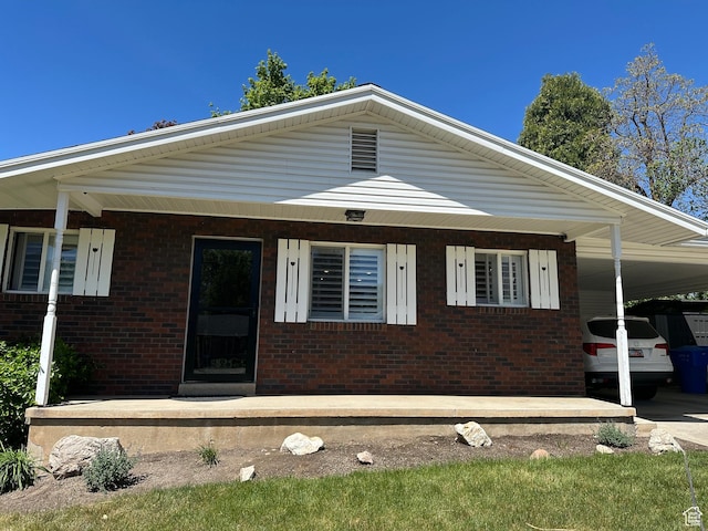 3081 N 100 E, North Ogden, UT 84414 - view of front of property with brick siding and a carport