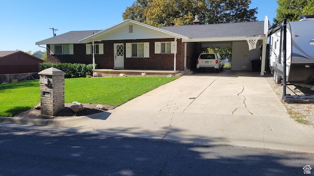 3081 N 100 E, North Ogden, UT 84414 - ranch-style home with a front yard, concrete driveway, an attached carport, brick siding, and covered porch