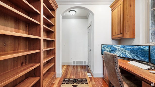 740 S Oak Dr, Woodland Hills, UT 84653 - office with crown molding, arched walkways, light wood-style flooring, and baseboards