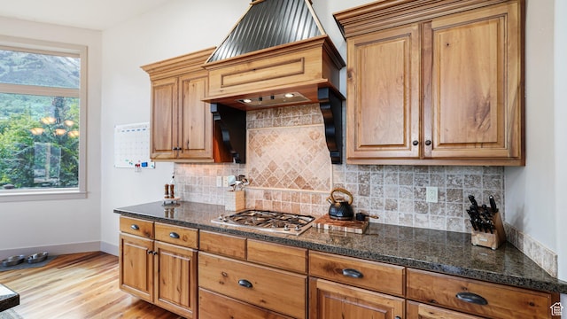 740 S Oak Dr, Woodland Hills, UT 84653 - kitchen with plenty of natural light, light wood-style floors, baseboards, and stainless steel gas stovetop