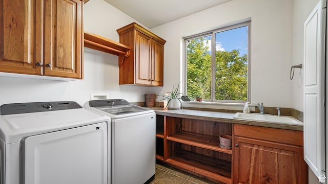 740 S Oak Dr, Woodland Hills, UT 84653 - laundry area featuring cabinet space, independent washer and dryer, healthy amount of natural light, and dark tile patterned flooring