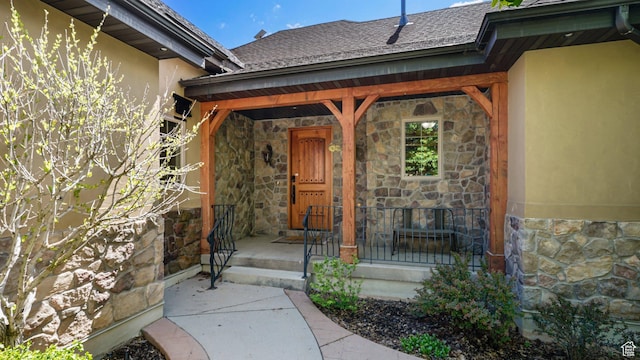 740 S Oak Dr, Woodland Hills, UT 84653 - entrance to property with stone siding, stucco siding, covered porch, and roof with shingles