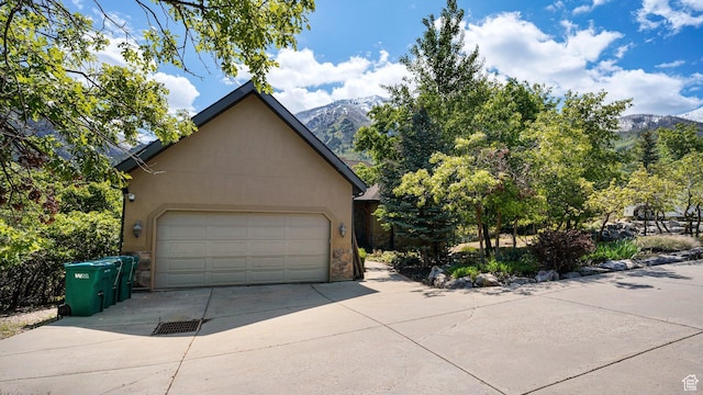 740 S Oak Dr, Woodland Hills, UT 84653 - garage featuring a mountain view and concrete driveway