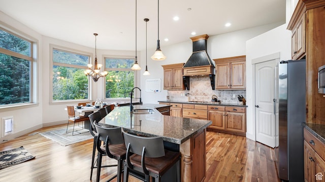 740 S Oak Dr, Woodland Hills, UT 84653 - kitchen featuring a sink, appliances with stainless steel finishes, light wood-type flooring, healthy amount of natural light, and recessed lighting