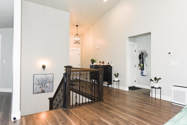 581 W 2030 N Unit 19A, Tooele, UT 84074 - stairway with wood finished floors, a chandelier, baseboards, and high vaulted ceiling