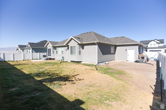 581 W 2030 N Unit 19A, Tooele, UT 84074 - rear view of house featuring stucco siding and a residential view