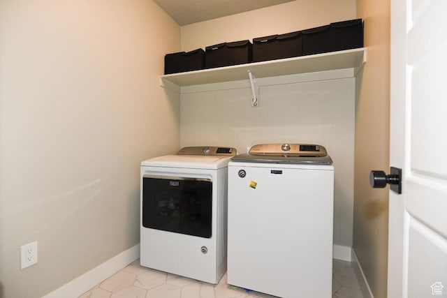 581 W 2030 N Unit 19A, Tooele, UT 84074 - laundry room featuring washing machine and clothes dryer and baseboards