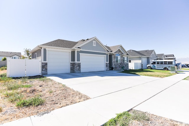 581 W 2030 N Unit 19A, Tooele, UT 84074 - craftsman-style house featuring a garage, driveway, and stone siding