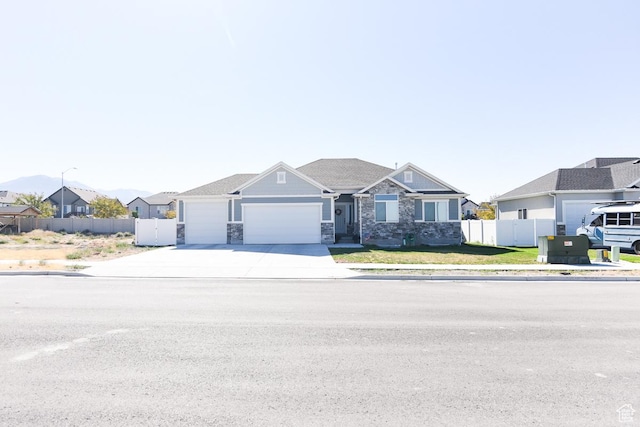 581 W 2030 N Unit 19A, Tooele, UT 84074 - craftsman house with an attached garage, stone siding, concrete driveway, and a residential view