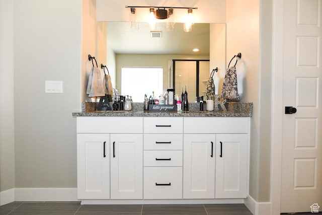 581 W 2030 N Unit 19A, Tooele, UT 84074 - full bath with double vanity, baseboards, and a shower with door