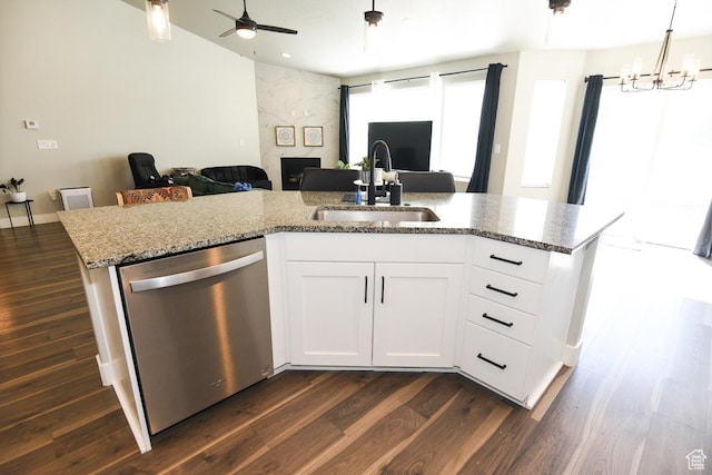 581 W 2030 N Unit 19A, Tooele, UT 84074 - kitchen featuring stainless steel dishwasher, open floor plan, a sink, dark wood-type flooring, and a large fireplace