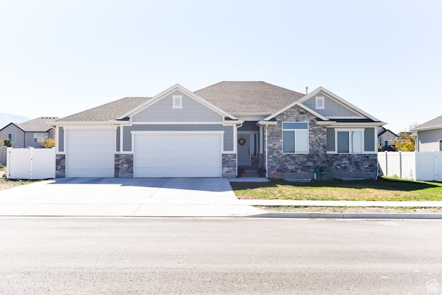 581 W 2030 N Unit 19A, Tooele, UT 84074 - craftsman house featuring a garage, stone siding, and concrete driveway