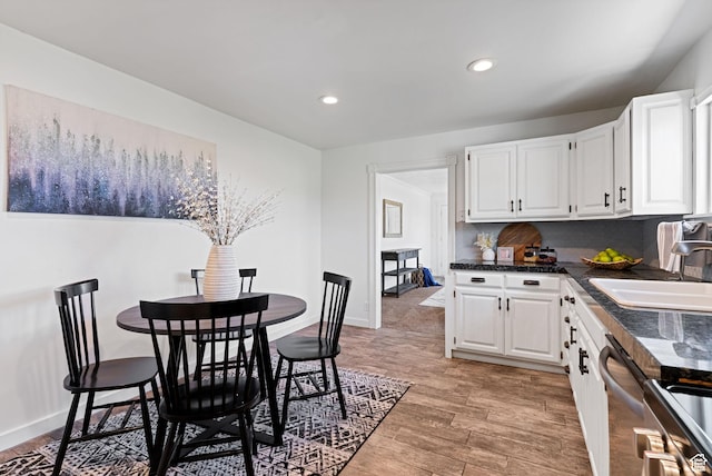 333 S 100 W, Payson, UT 84651 - kitchen with a sink, dark countertops, white cabinetry, recessed lighting, and light wood-style floors